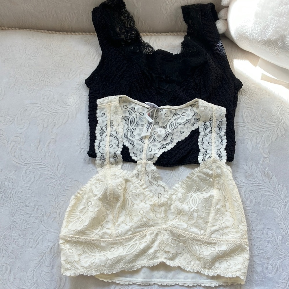 Two stretch lace bralettes/camisole tops in cream (new) and black (gently worn).